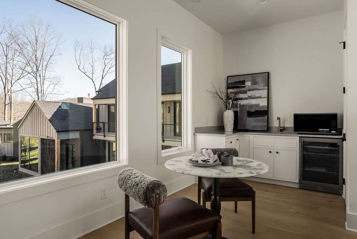 Inside the 1,200 square foot DADU, thoughtfully designed with a kitchenette, dining area, and abundant natural light.