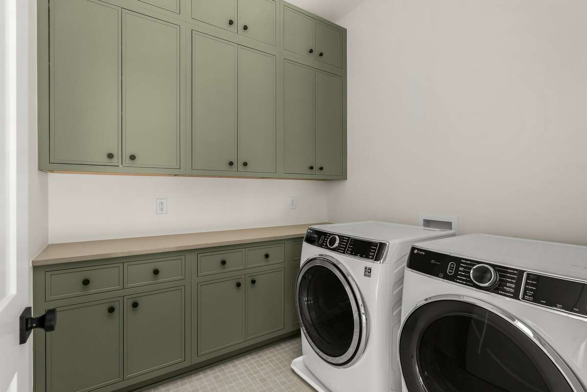 Upstairs laundry room for added convenience.