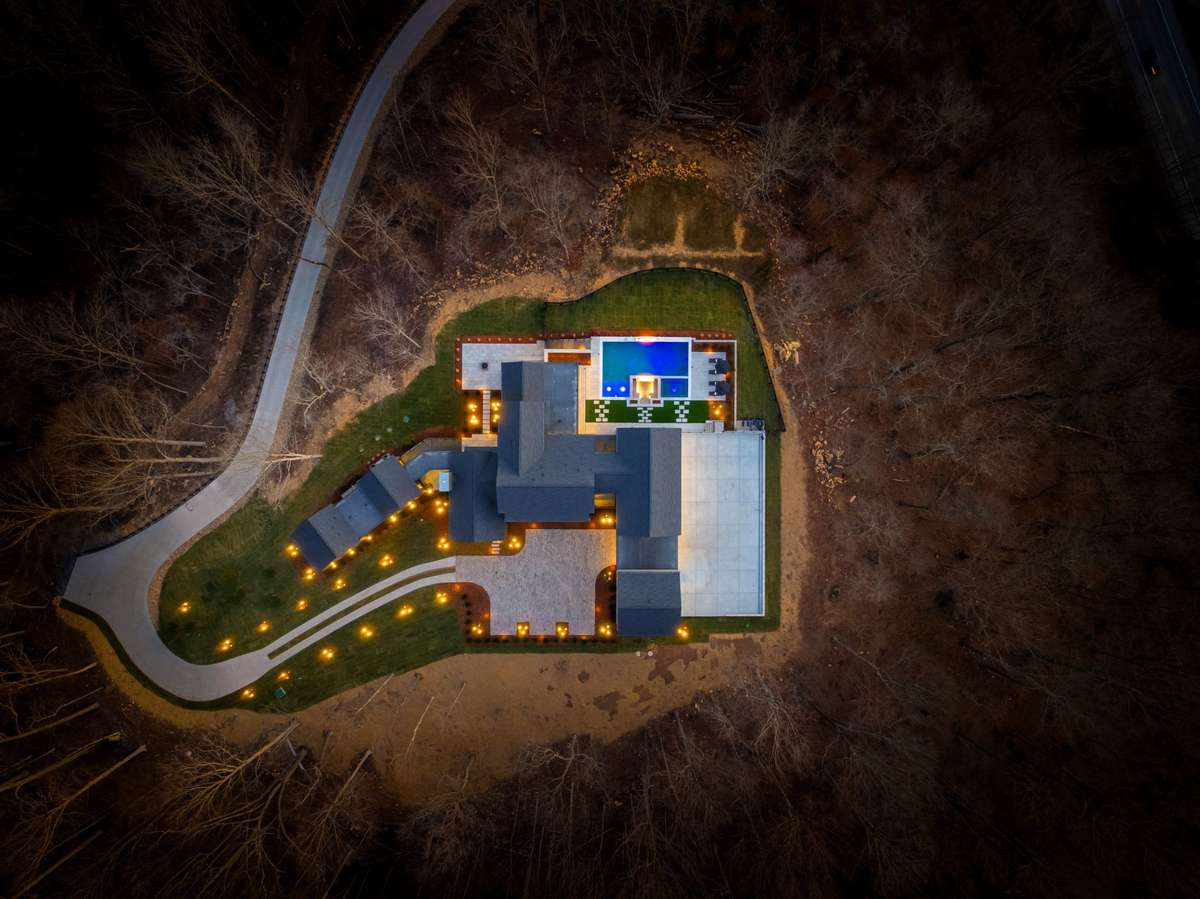 Aerial perspective highlighting the full scale of Hill House Estate, set on nearly 10 private acres with a commanding hilltop position and exceptional privacy.