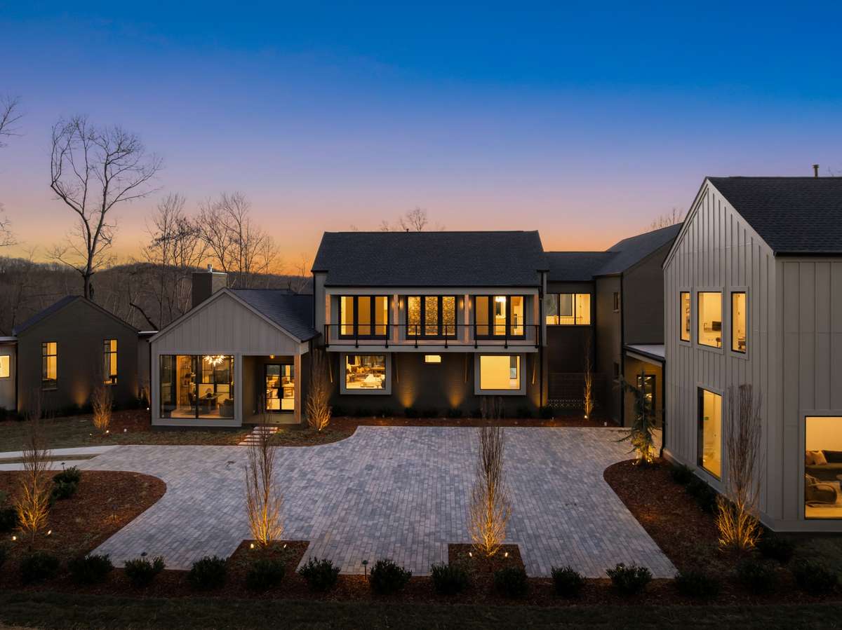 Additional exterior view highlighting the home’s clean architectural lines, layered rooflines, and thoughtfully designed outdoor spaces that complement the surrounding natural setting.