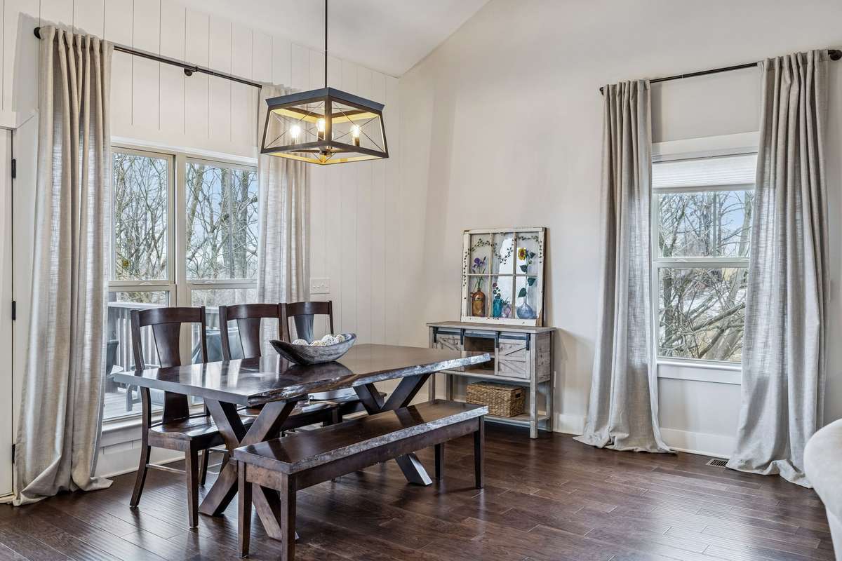 Large windows and high ceilings set the tone for the breakfast room