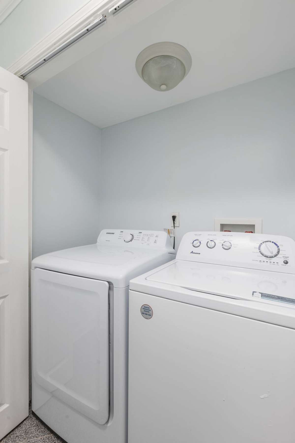 Laundry room on the first level with washer and dryer that will remain