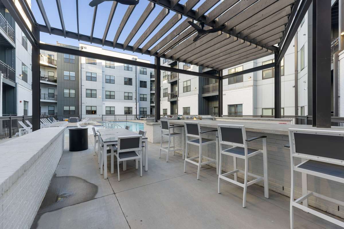 Outdoor kitchen plus deck with pergola is another amazing community amenity for residents