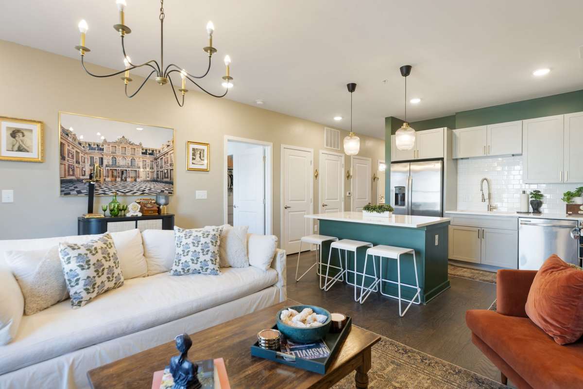 Beautiful, light-filled unit at Silo with accent green walls and custom light fixtures