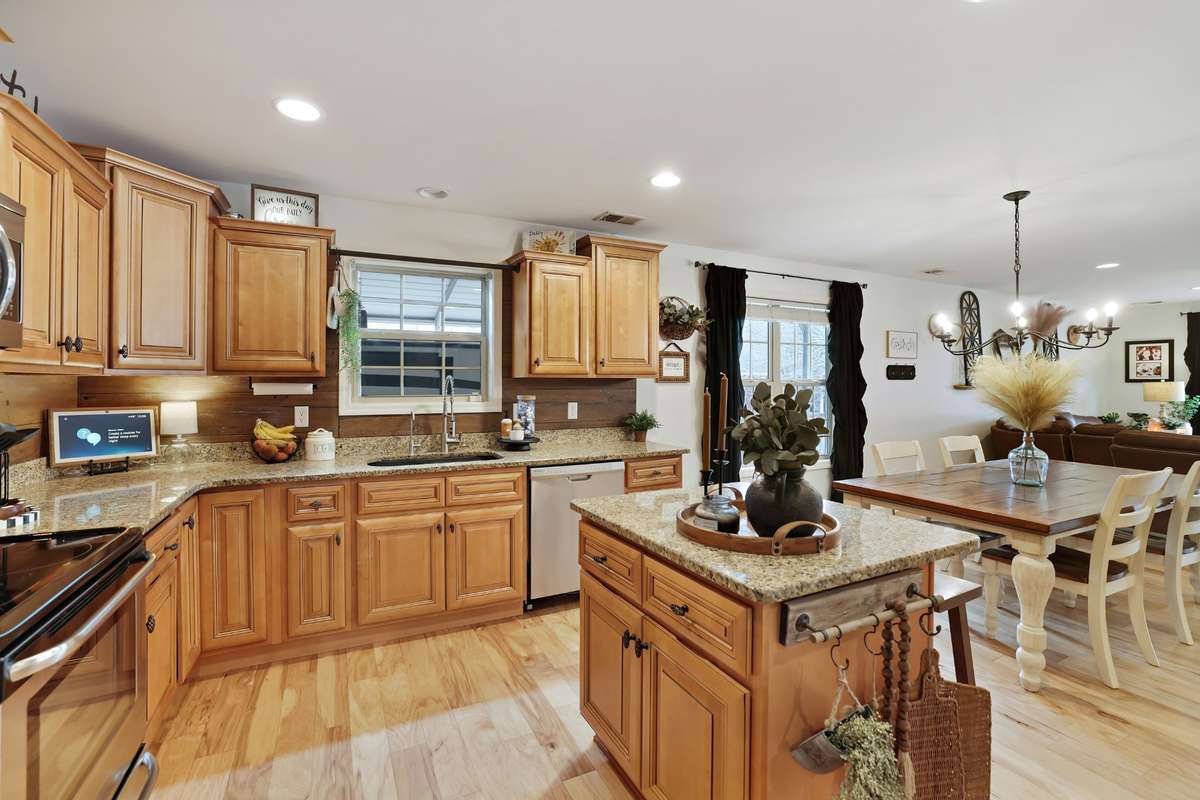 Granite countertops, farmhouse sink, solid surface floors... all ready for your culinary adventures!