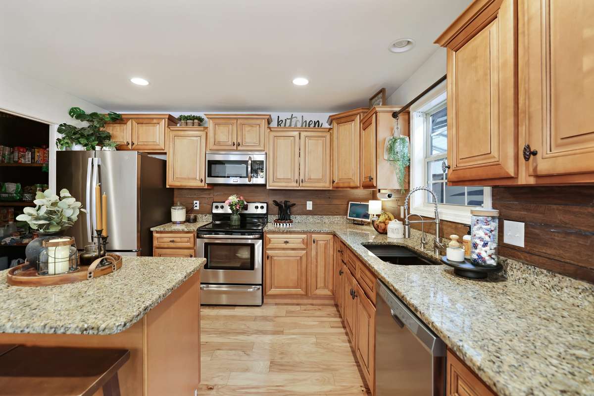 Notice the modern yet rustic "wood" tile backsplash!
