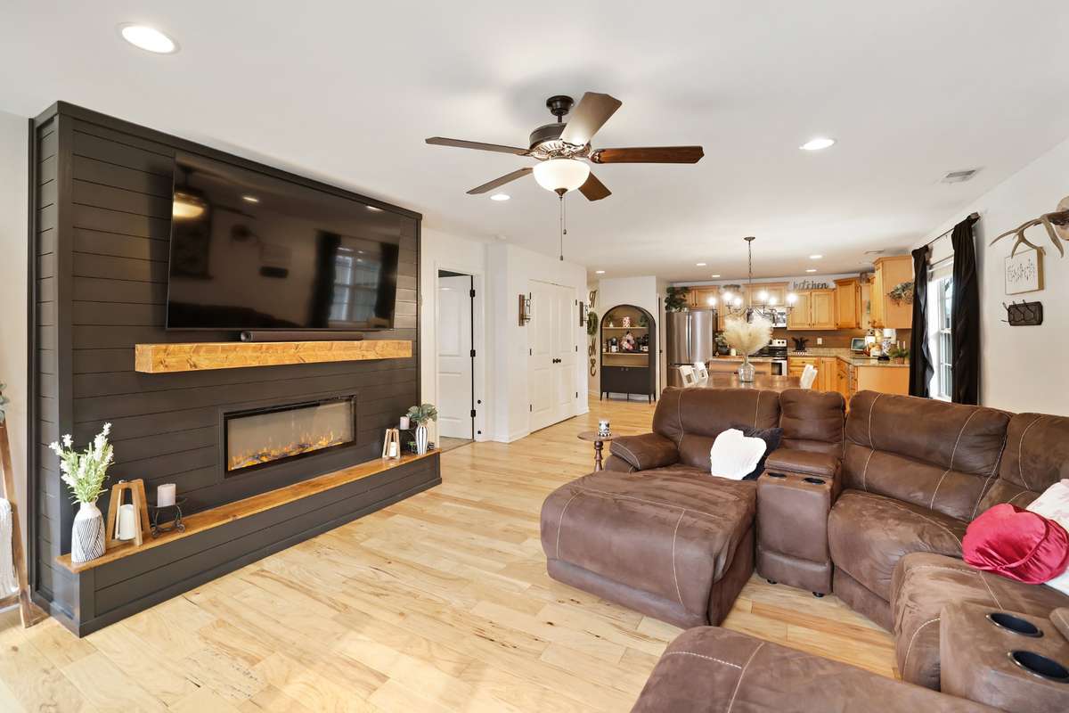 Stunning new (2025) custom shiplap fireplace feature wall with built in storage!