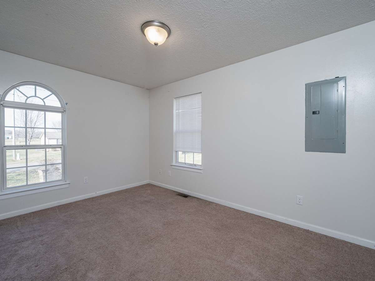 Bedroom 3 has natural light and carpet