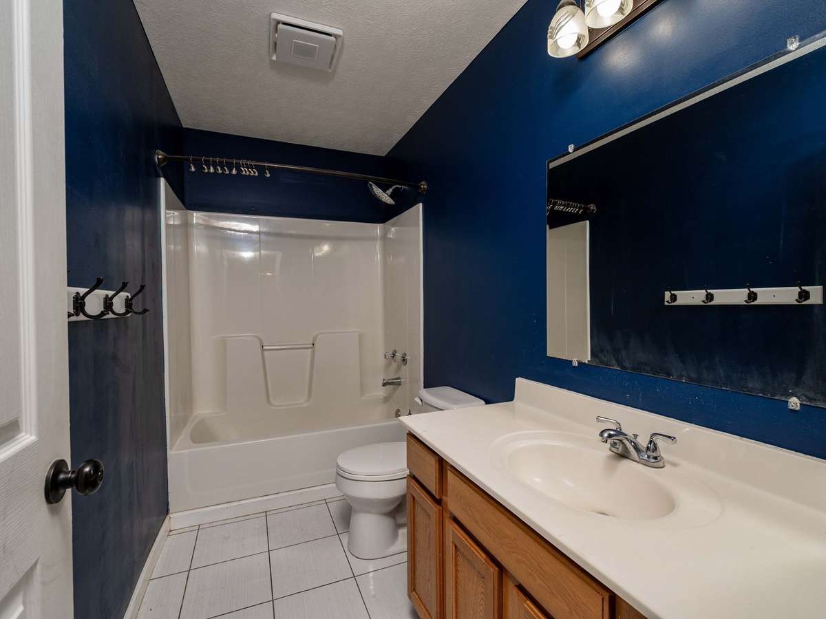 Guest bath, tile flooring and large vanity