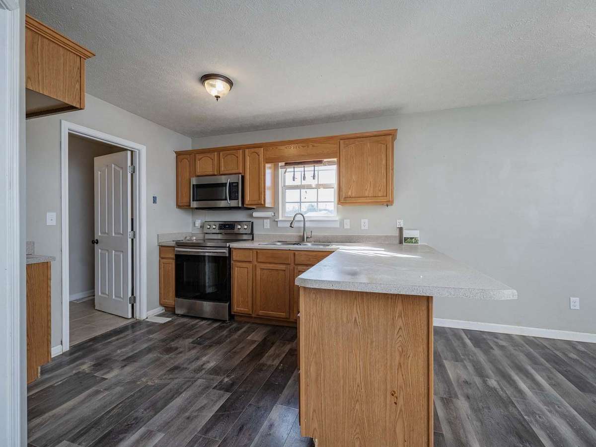 Kitchen features MW DW and stove