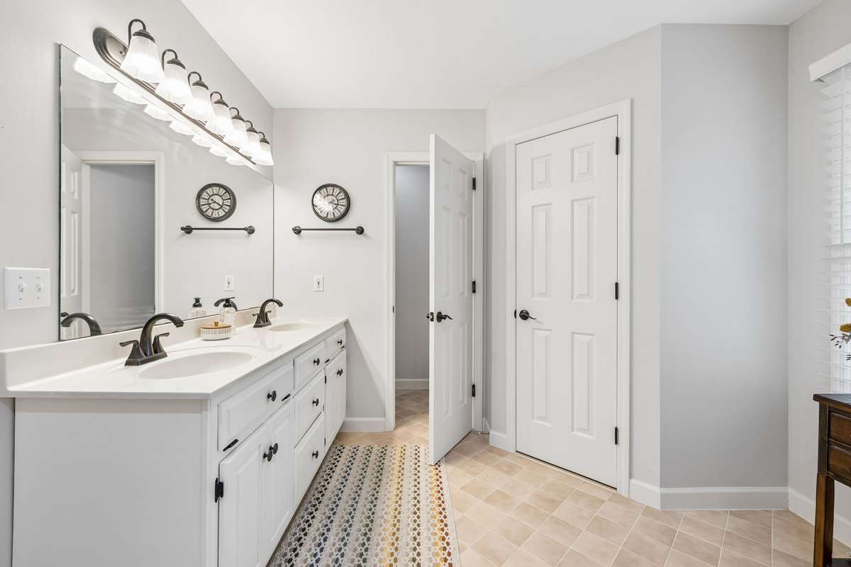 Primary Bathroom With New Hardware & Lighting