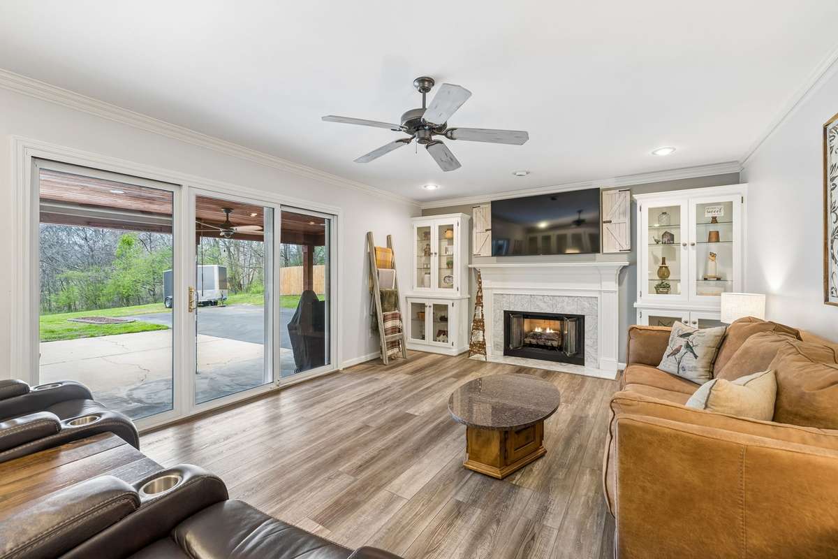 Sun Filled Living Area With Fireplace