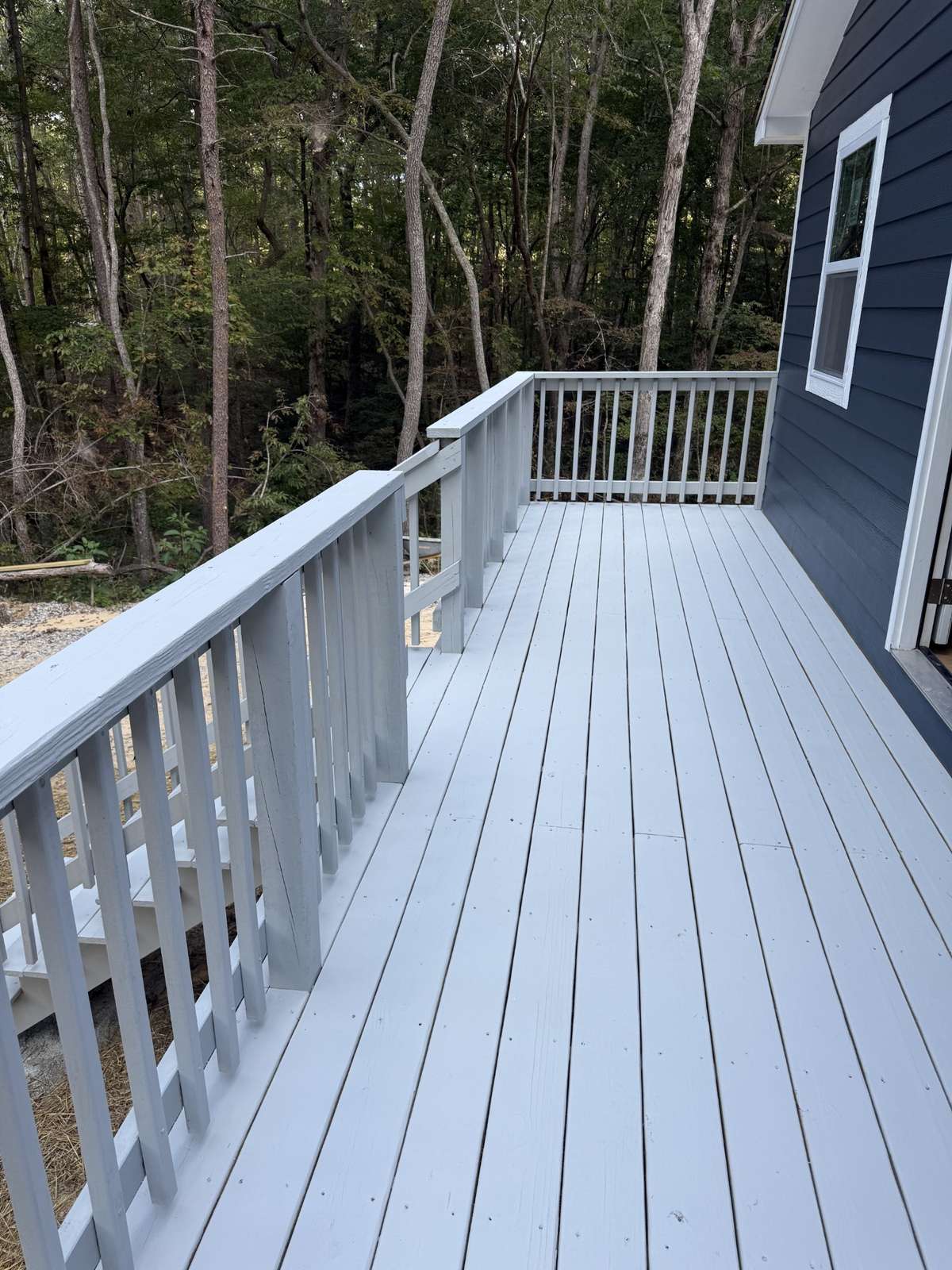 Ample deck for rocking chairs and cooking out.