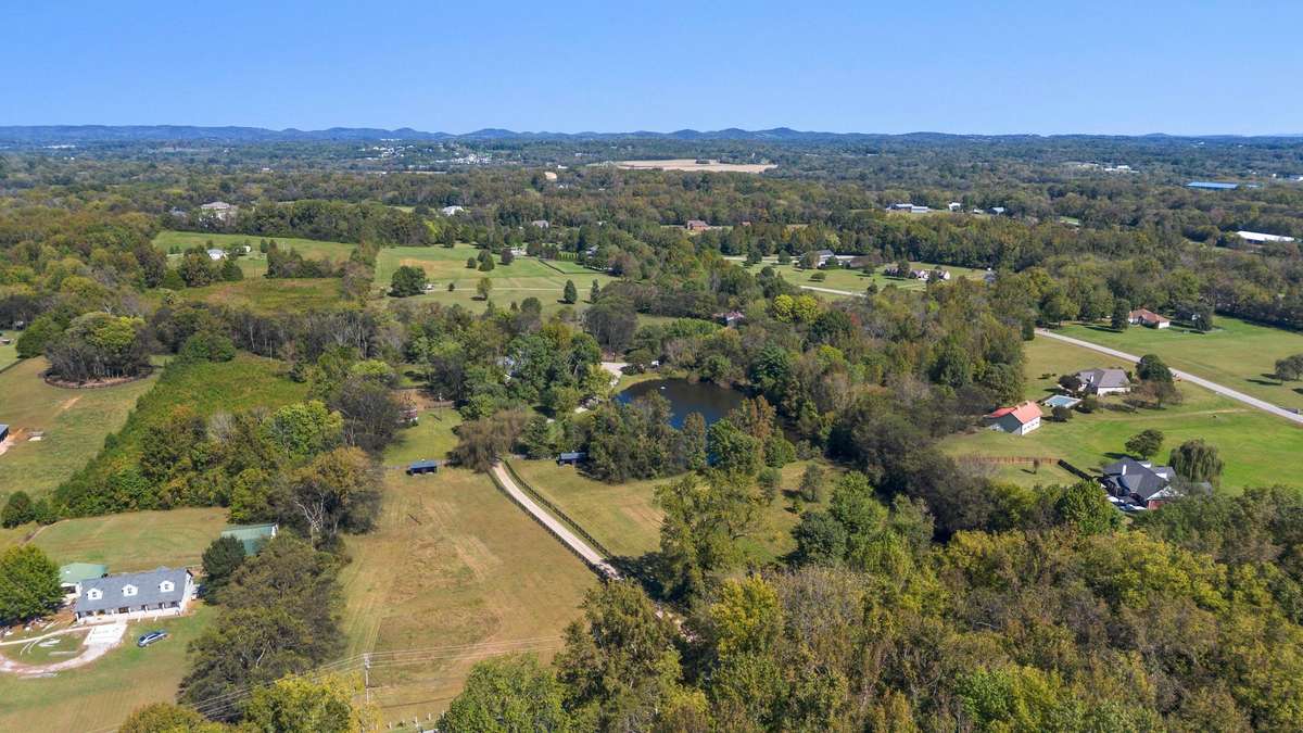 The home sits on fifteen gorgeous acres with a two acre pond.