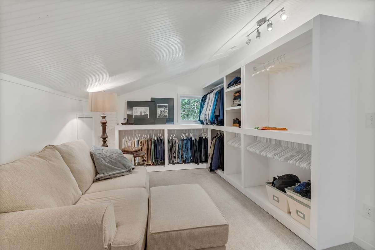 Sitting area in walk in closet.