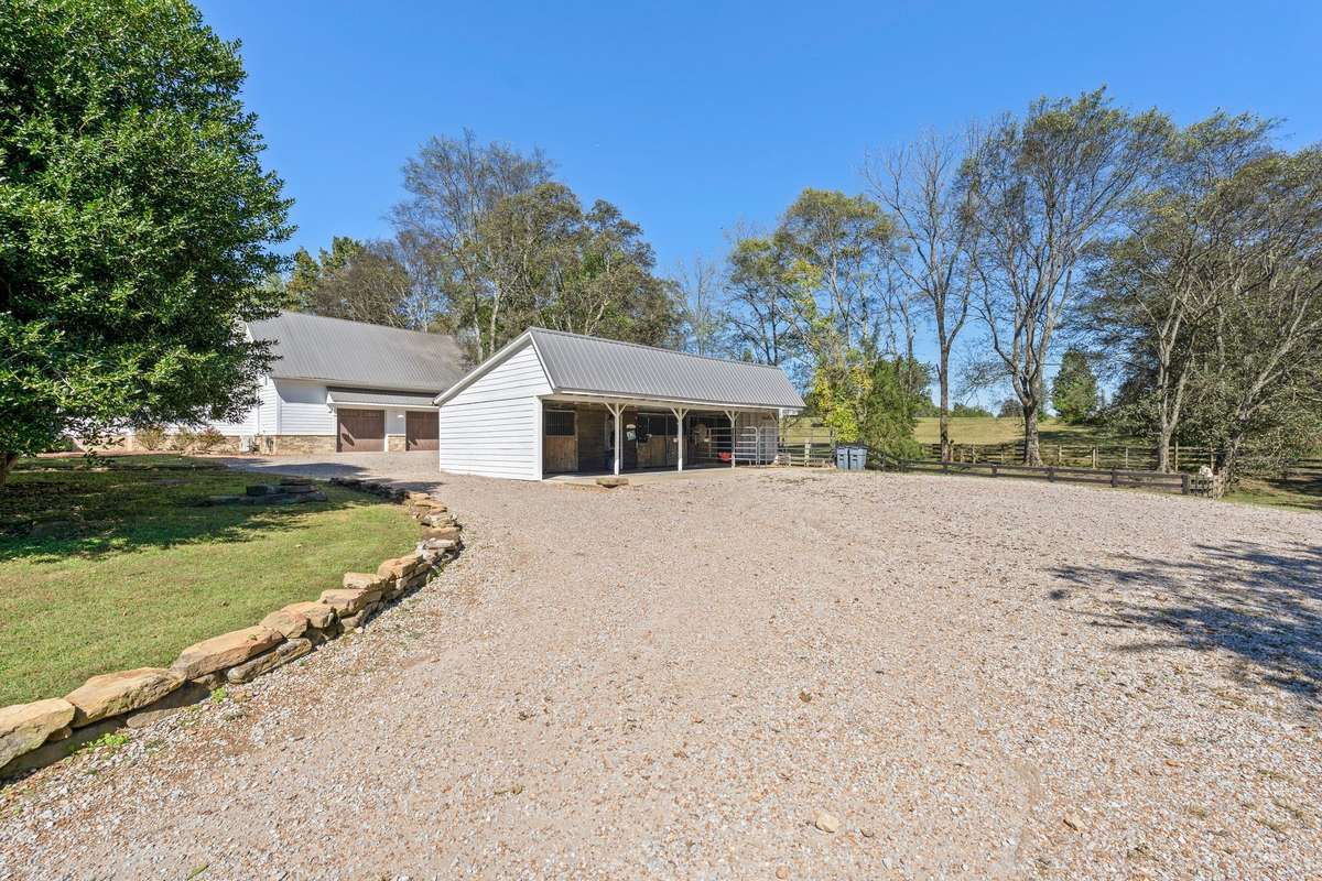Stables for horses or a work area and storage.
