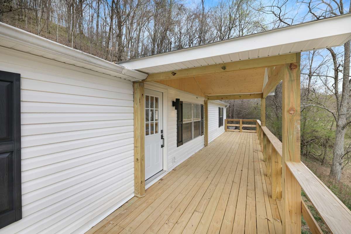 Extra large front deck with a covered center so you can enjoy sitting out in all weather