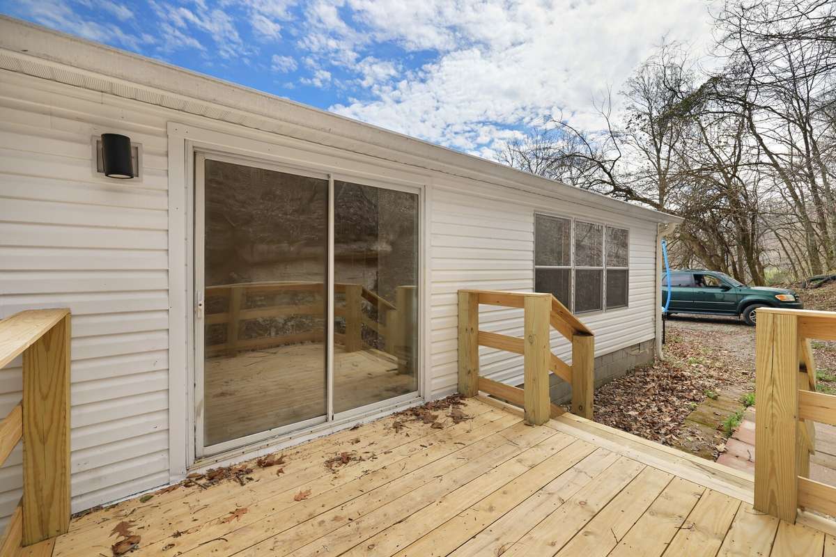 Back deck (with sliding glass doors leading from kitchen area)