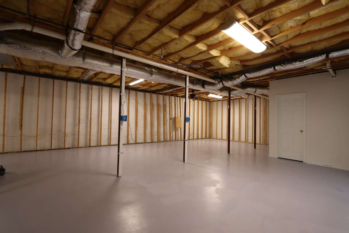 Incredible Unfinished Basement Is Truly a Canvas for Your Imagination! Easily Finish for Extra Bedrooms, Recreation Room, Home Gym, or Craft Room - The Possibilities Are Endless! Complete with Full Bathroom, Outdoor Access, & Mitsubishi Mini Split.