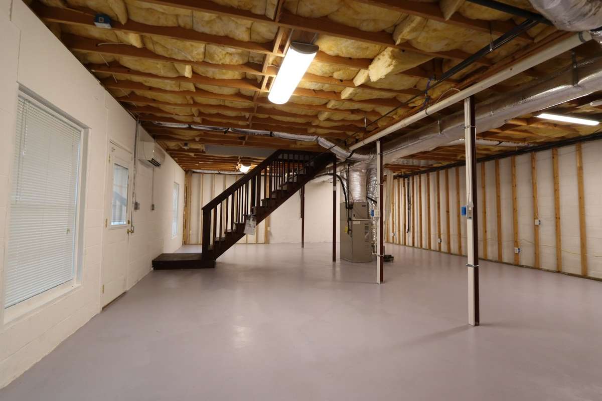 Incredible Unfinished Basement Is Truly a Canvas for Your Imagination! Easily Finish for Extra Bedrooms, Recreation Room, Home Gym, or Craft Room - The Possibilities Are Endless! Complete with Full Bathroom, Outdoor Access, & Mitsubishi Mini Split.