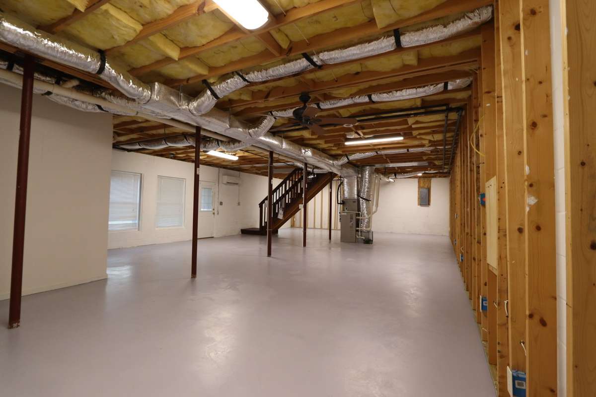 Incredible Unfinished Basement Is Truly a Canvas for Your Imagination! Easily Finish for Extra Bedrooms, Recreation Room, Home Gym, or Craft Room - The Possibilities Are Endless! Complete with Full Bathroom, Outdoor Access, & Mitsubishi Mini Split.