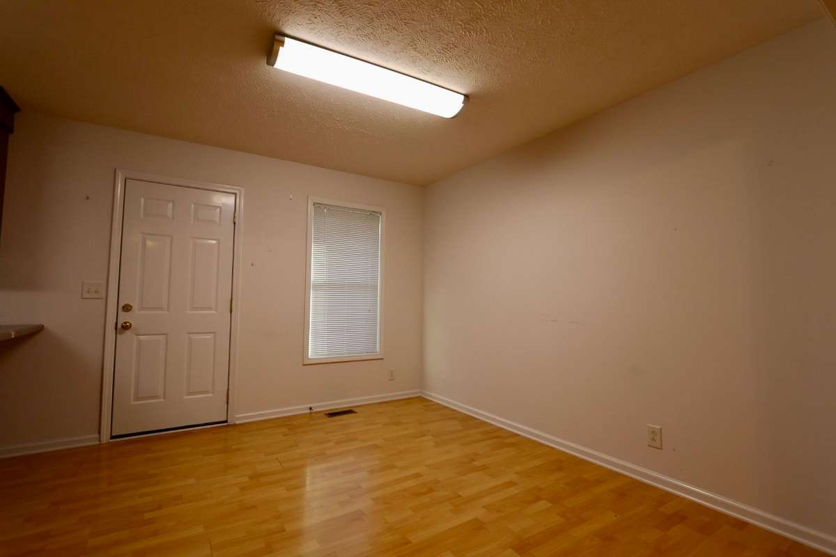 Separate 12 x 10 Dining Area Off Kitchen with Outdoor Access to Deck with Stairs to Lower-Level Patio