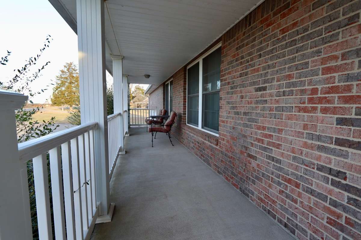 Lovely Covered Front Porch to Enjoy the Sunrise with a Cup of Coffee