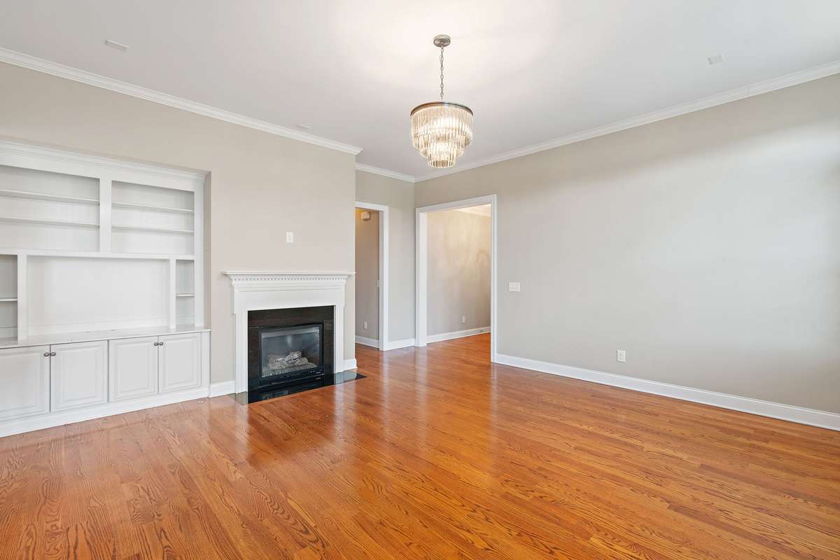 Living room with built in shelves and fireplace
