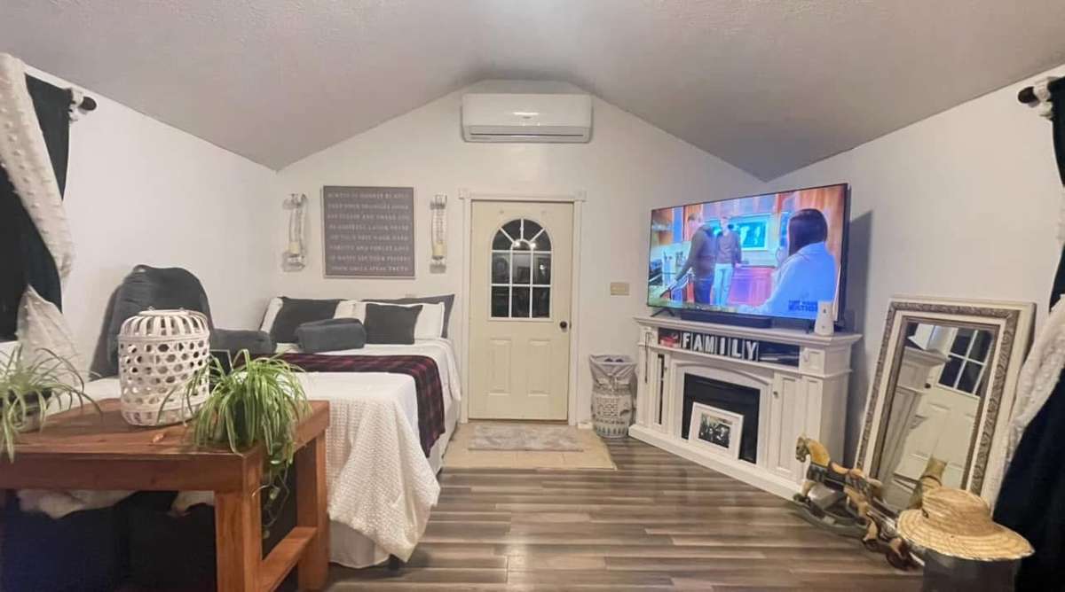 Studio style living space. (Note--electric fireplace and TVs will not remain).