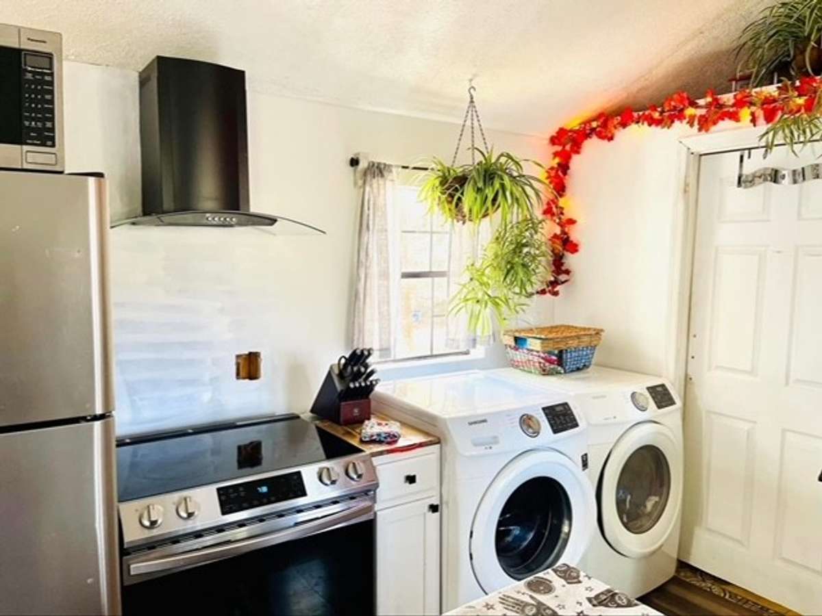 Washer and Dryer also to remain.  Door to right of washer and dryer gives access to full bathroom.