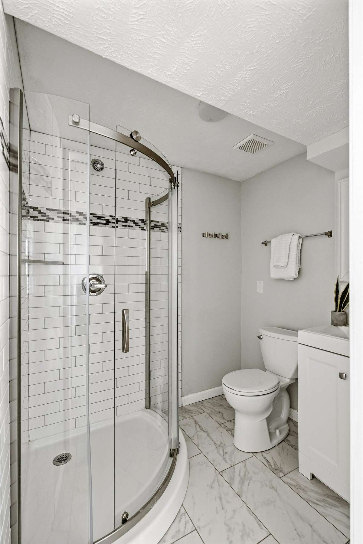 The third full bathroom is located just off the laundry room.