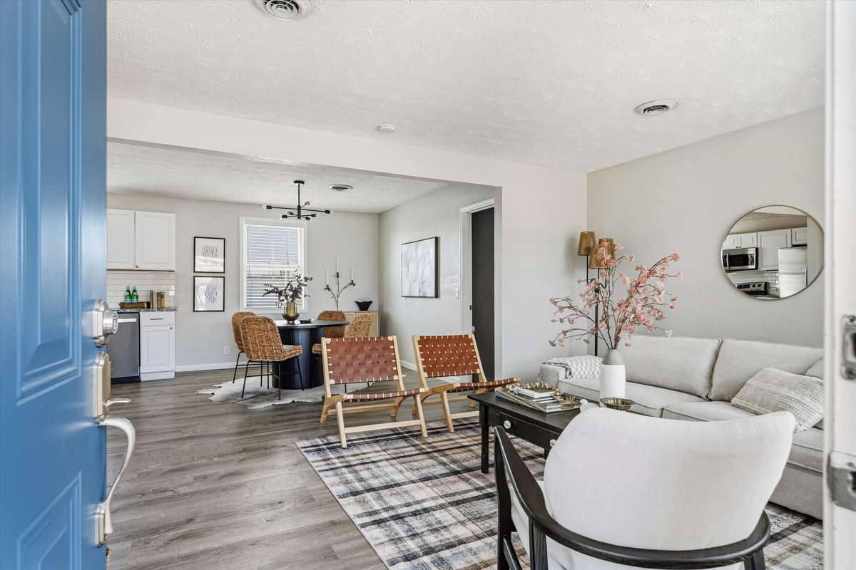 The living room flows into the kitchen and dining area for ease of gathering and entertaining.