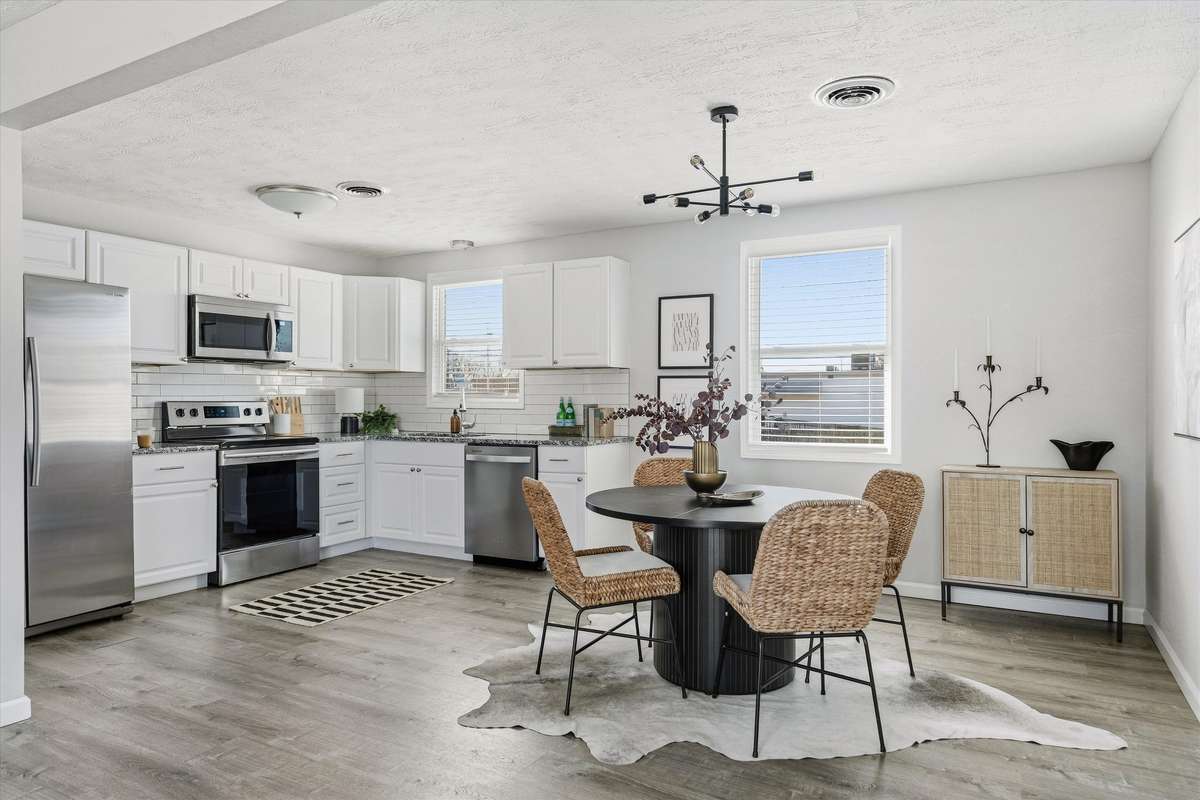 The kitchen was fully renovated in 2019 with new cabinets, stainless steel appliances, granite countertops and a tile backsplash.