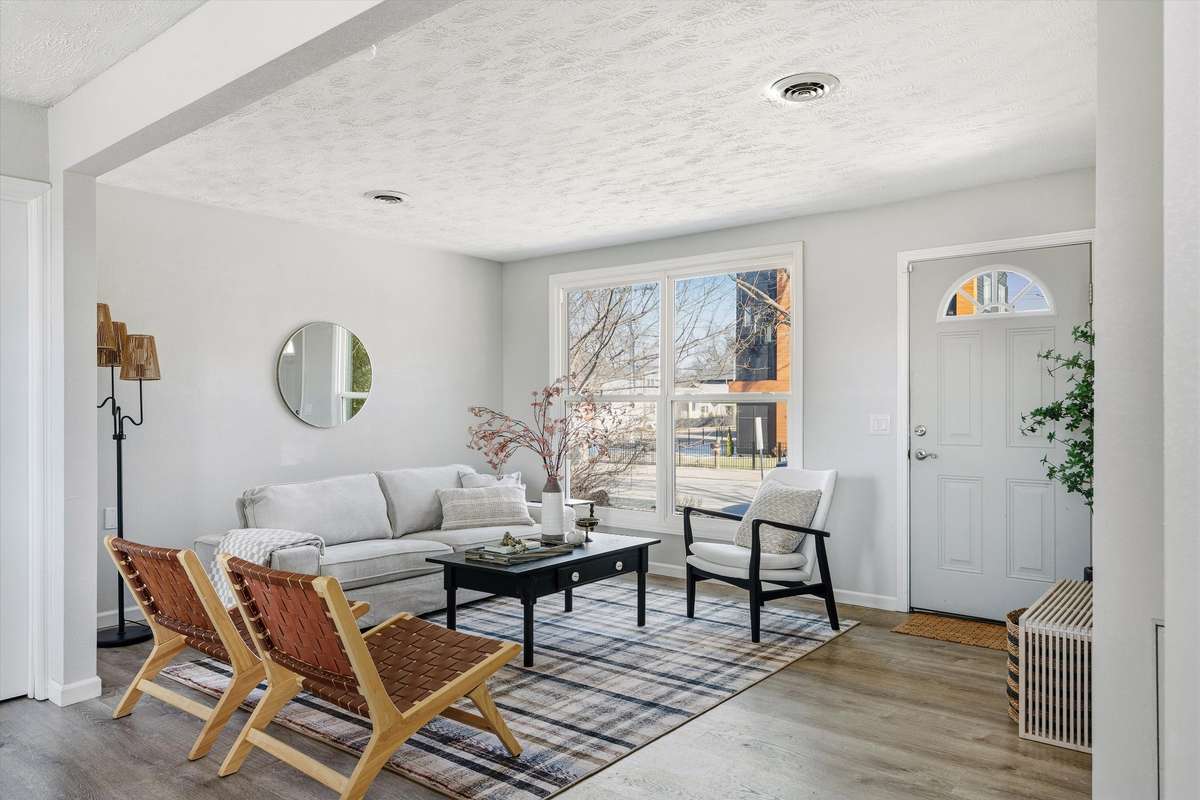 The large windows in front bathe the living room in natural light.