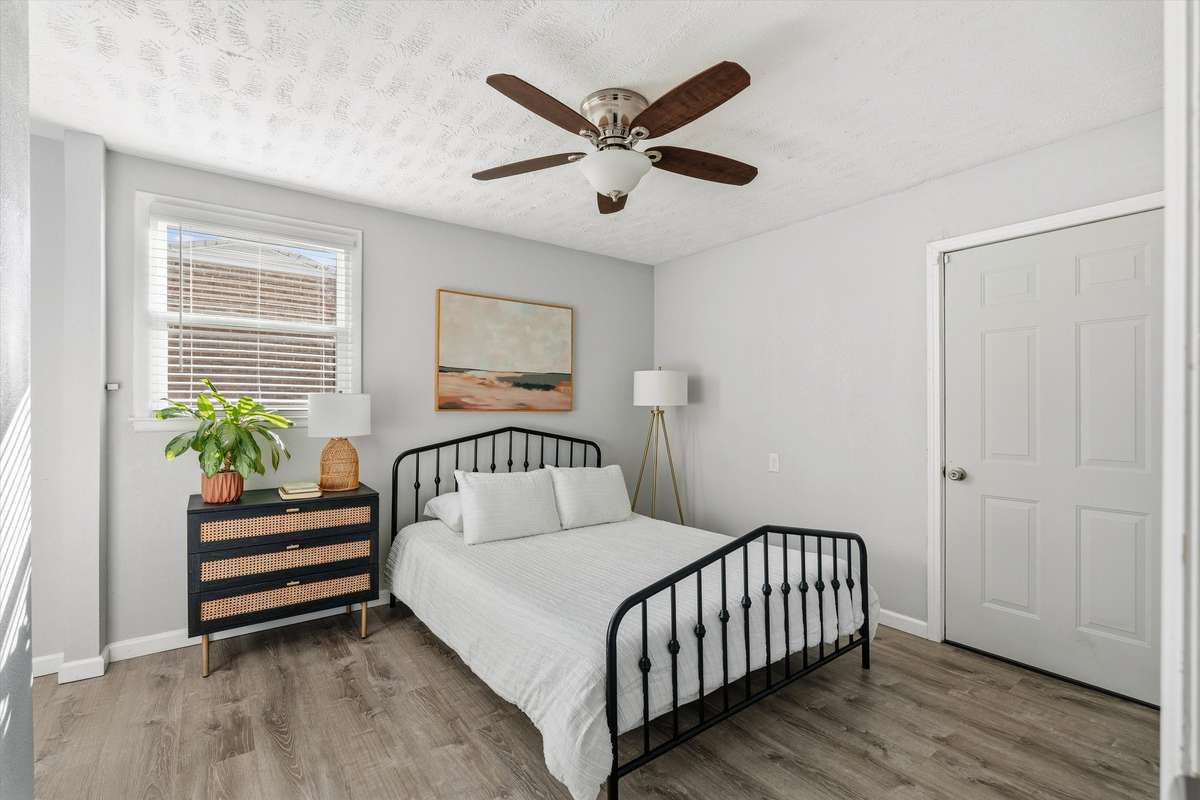This home has a true primary suite, which is not common in older homes! The door on the right leads to the beautiful back deck.