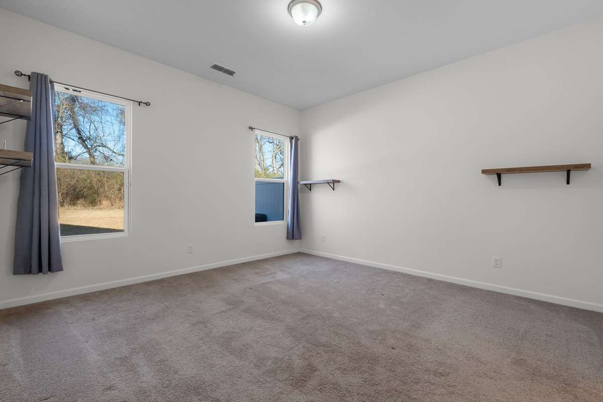 Primary Bedroom suite with hanging shelves