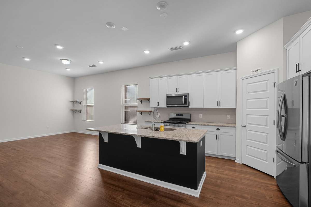 Refrigerator included! Bar stools area under island