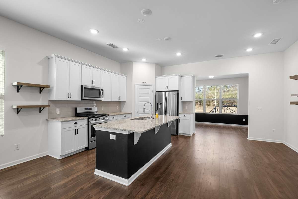 Kitchen with island, SS appliances and granite countertops