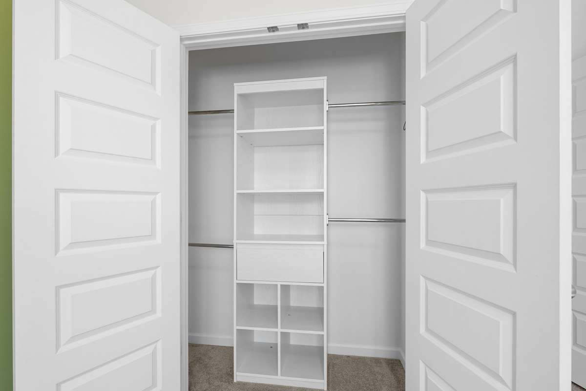 Bedroom 2 has nice custom closet organizer