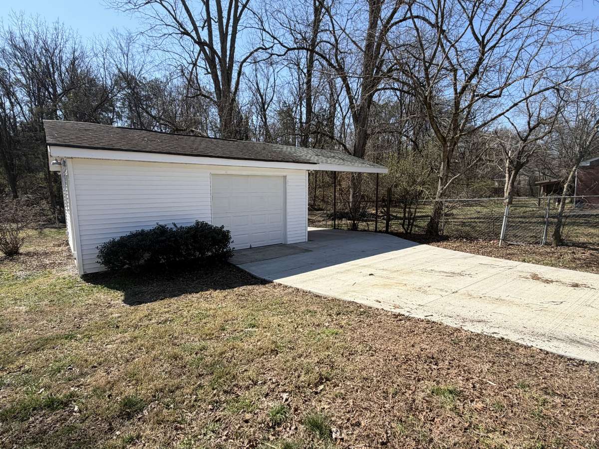 Detached workshop with carport