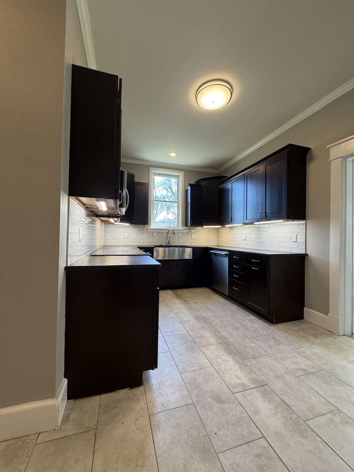 Kitchen with cherry cabinets, granite countertops and stainless steel appliances