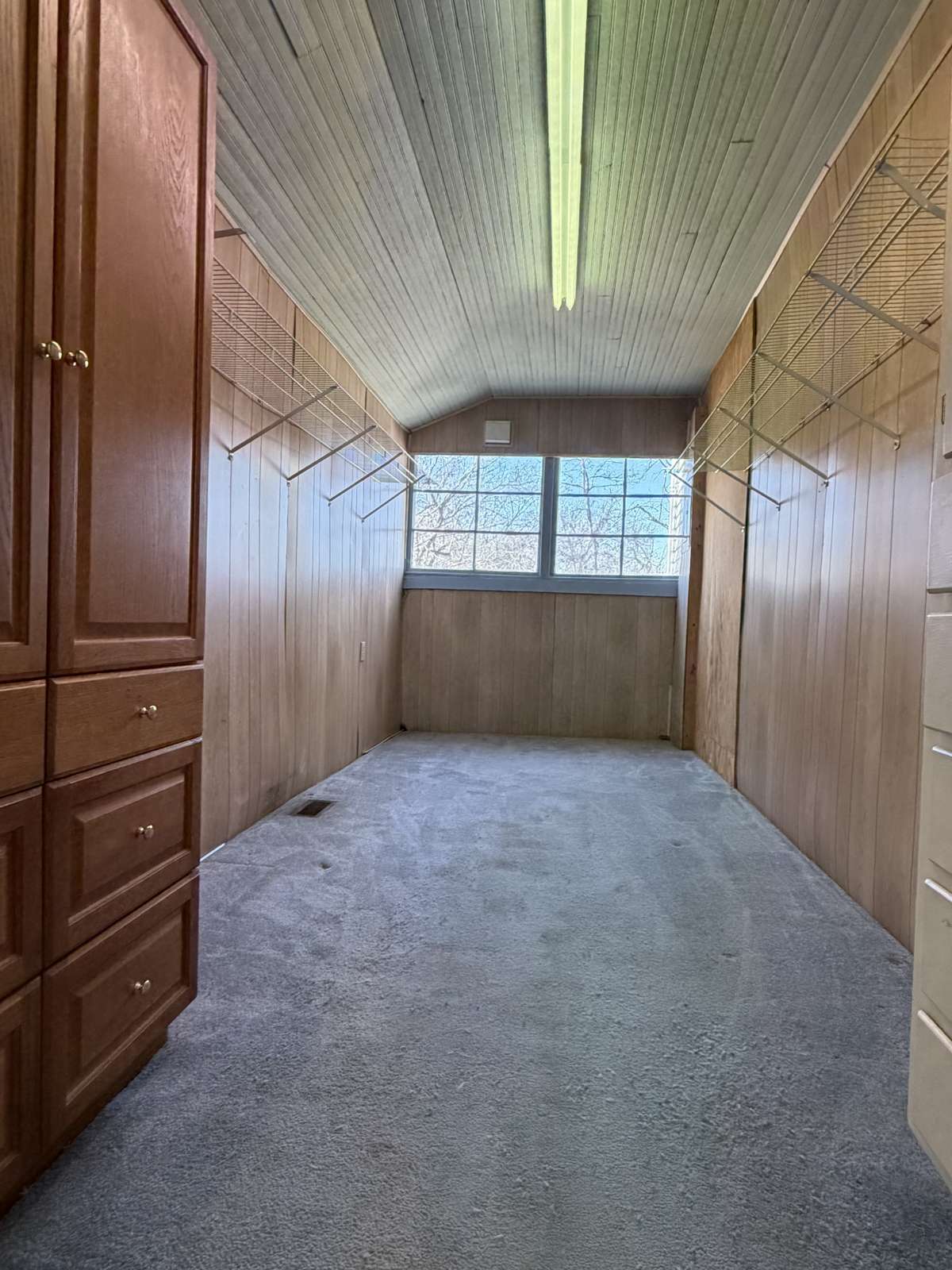 Generous sized storage room right off of the Laundry Room (the cabinets remain).