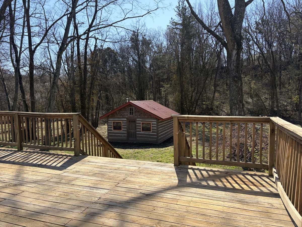 Large deck overlooking your very own log cabin with logs dating back to 1872