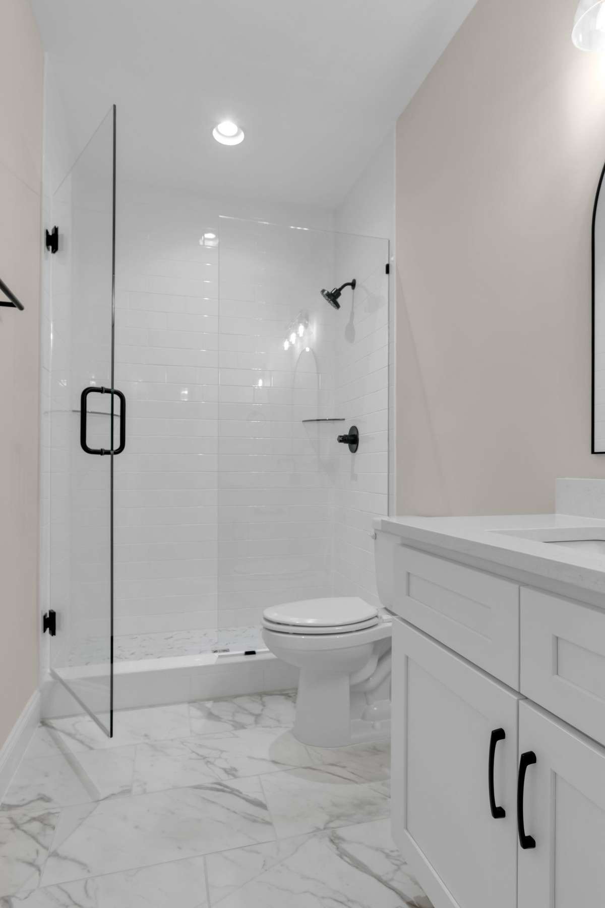 Photo of bathroom 3 upstairs - frameless shower also with the black finishes.