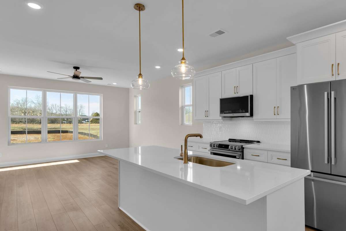 View from the kitchen area onto the great room with so much natural light to enjoy daily!