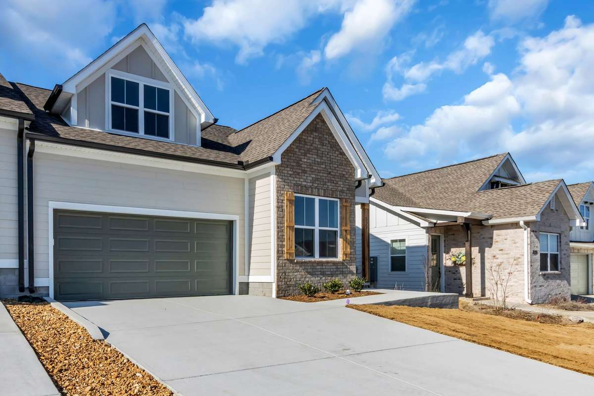 View of the spacious driveway and there are sidewalks to take daily walks around this tranquil neighborhood that is so convenient to all the shops in Smyrna or 12 minutes from the new Publix in Nolensville.