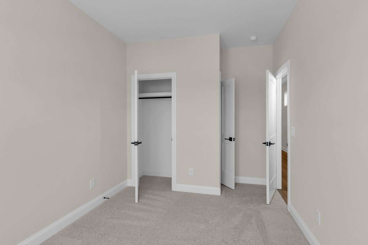 Additional bedroom on the first floor perfect for spare guest room or home office.