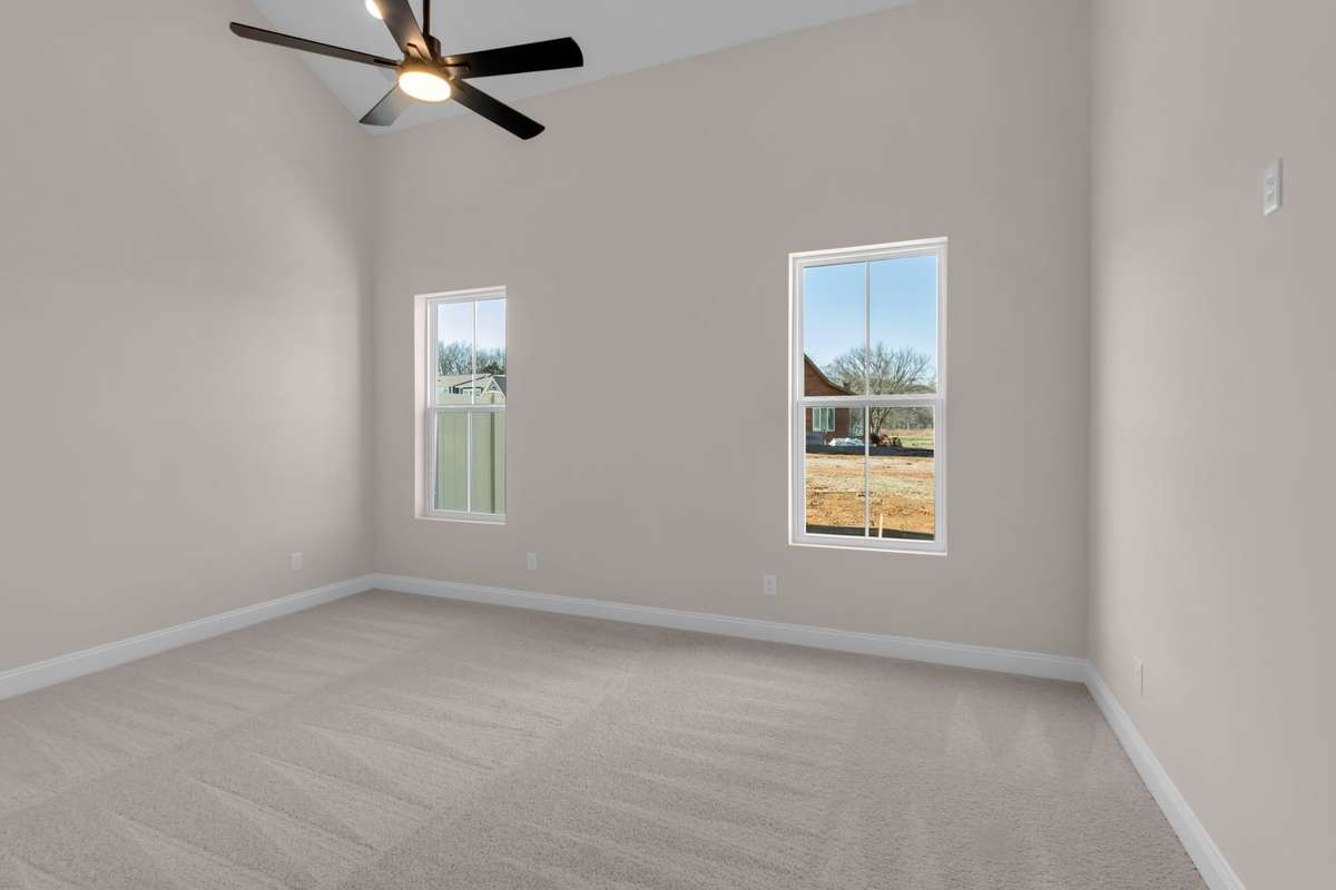 Soaring ceilings welcome you into the owners bedroom that make this space feel so open and spacious.