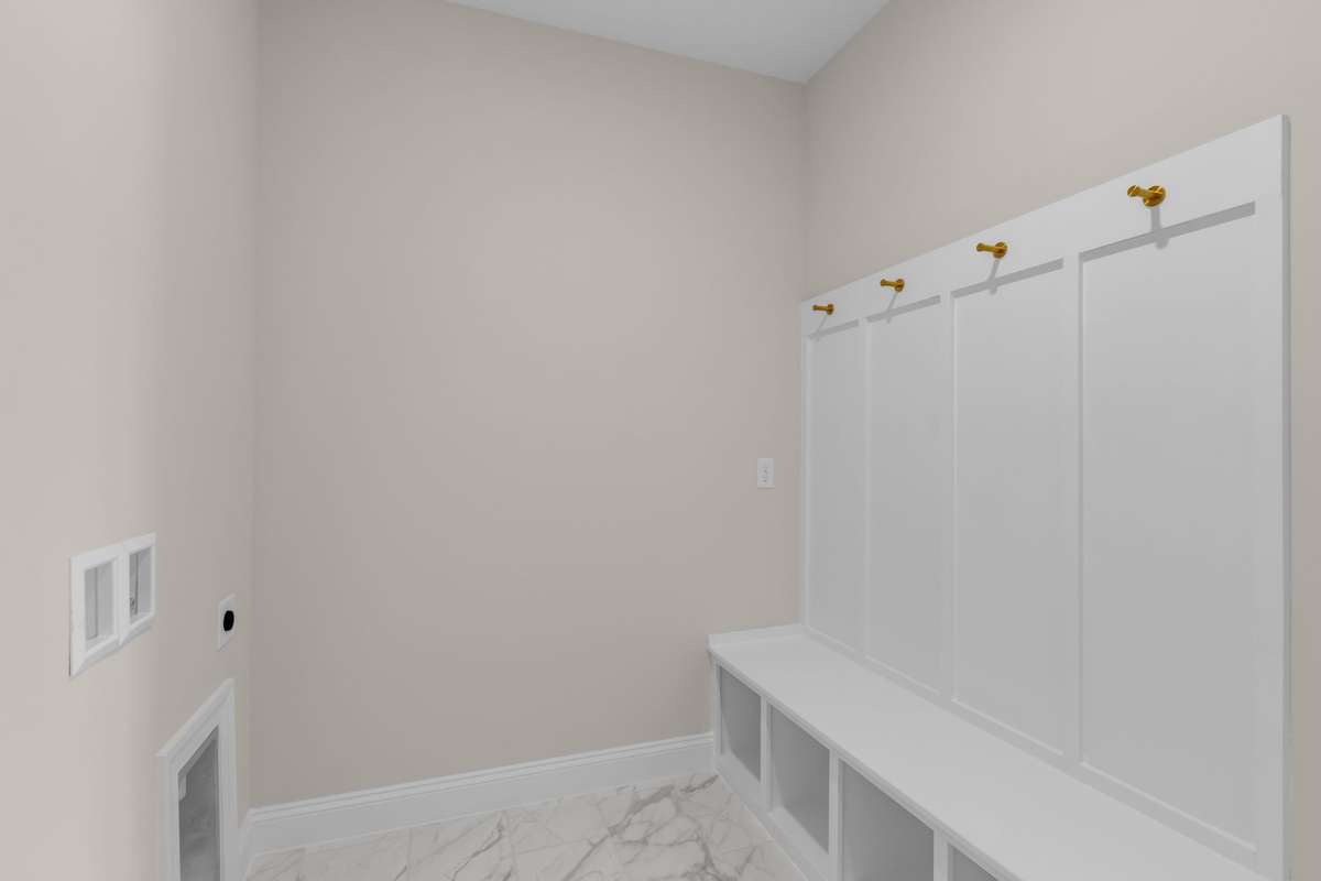 Drop zone in the laundry room off your 2-car attached garage. A perfect place to sit down and put your shoes on and spaces to put baskets to hold all the things.