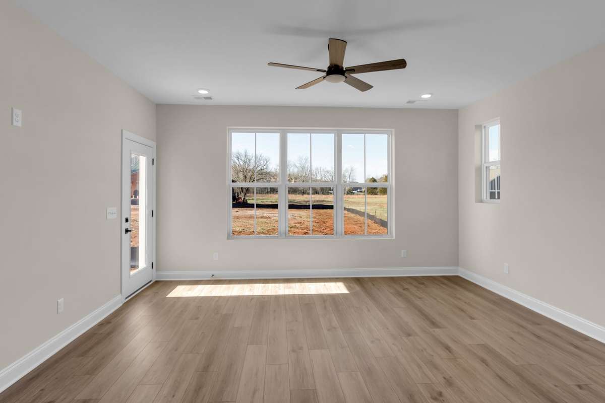 Great room with back door to your back patio area that has privacy divider.